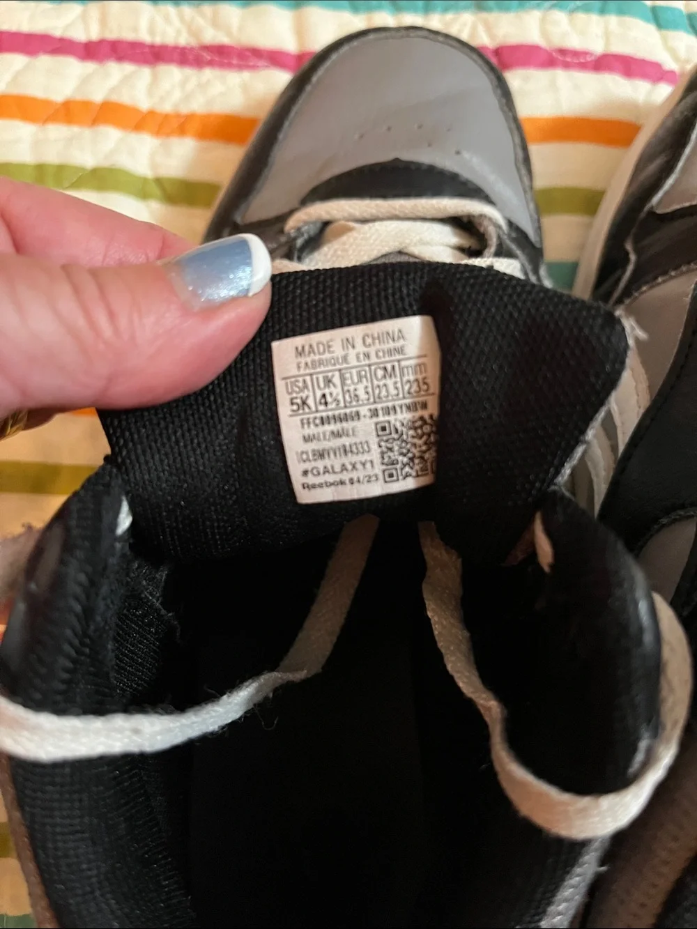 Gray and black Reebok youth size 5